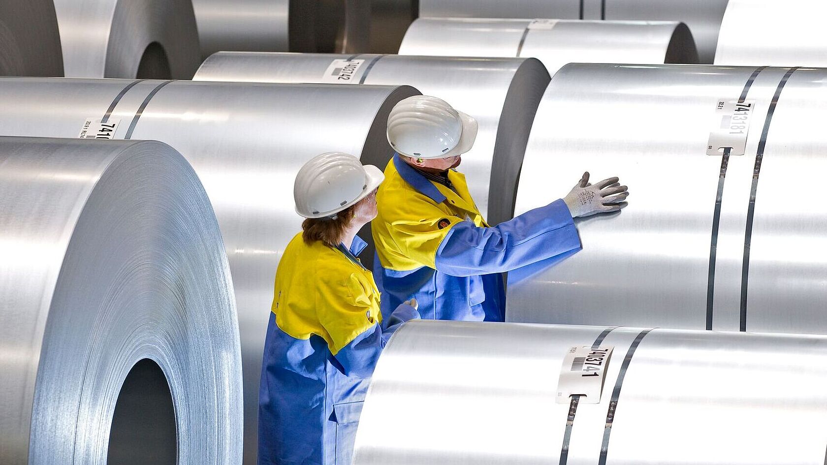Quality inspection of a steel coil by Tata Steel Nederland employees during the production process.